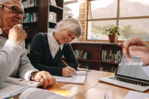 Senior couple participating in lifelong learning course in the library