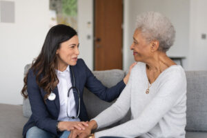 Female doctor and senior woman talking