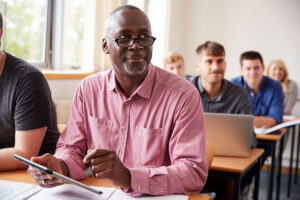 Senior man in class for lifelong learning