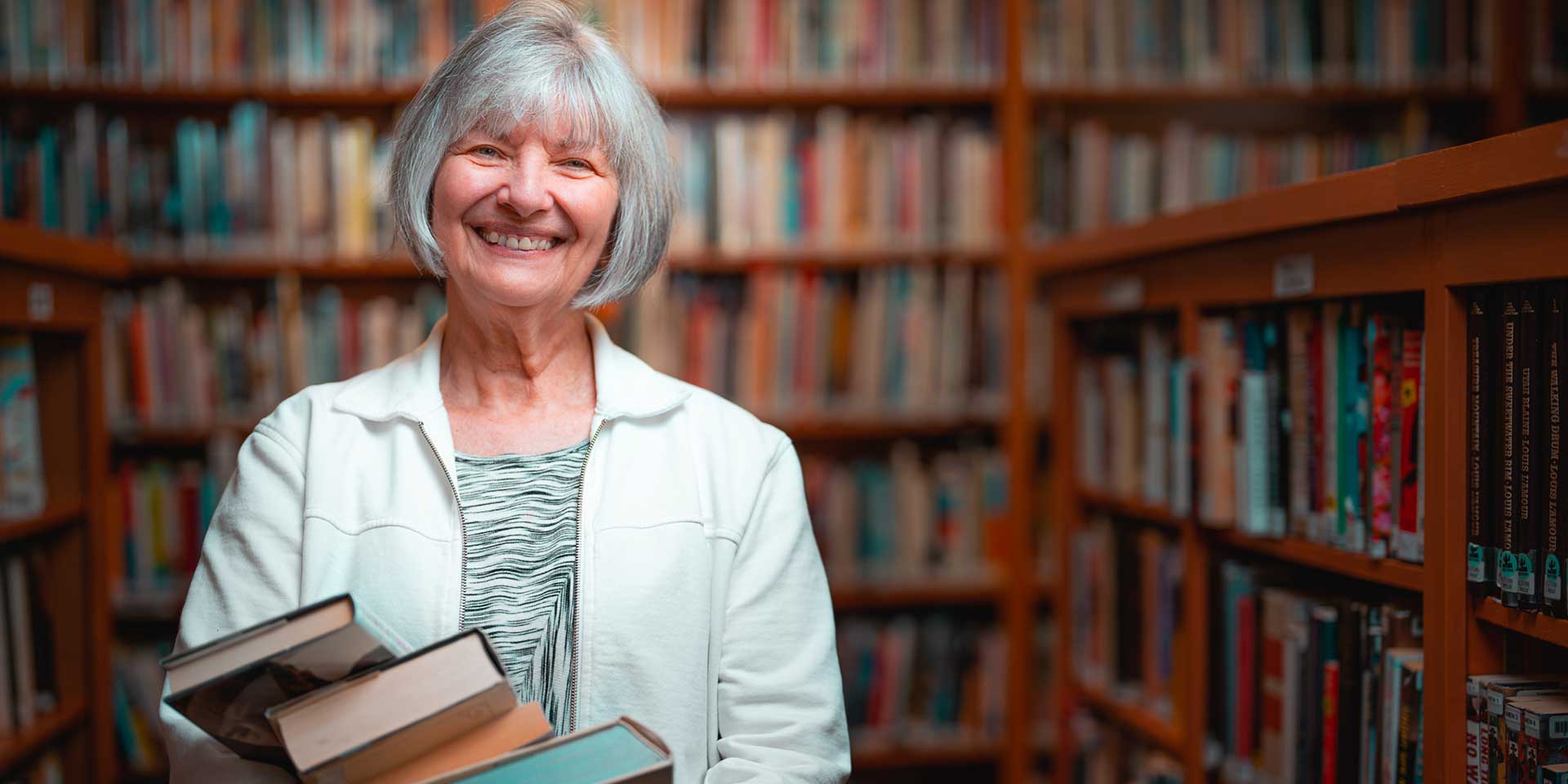 Friendsview resident with books